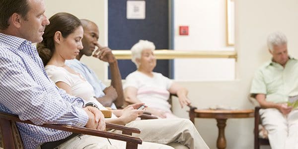 Patients seated in a waiting room