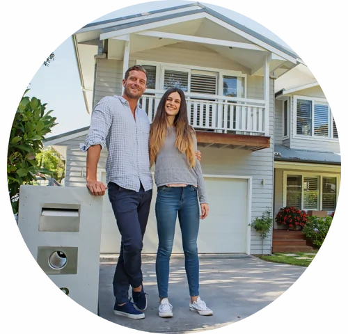 GP Relocation Melbourne - A young couple looking standing outside their house.