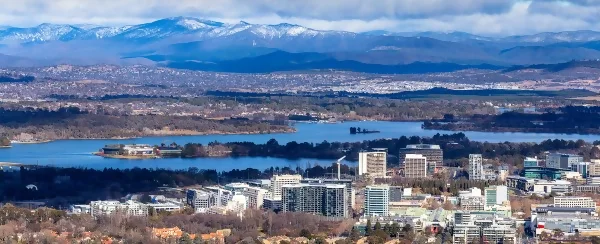 Canberra with snow covered mountains in the background