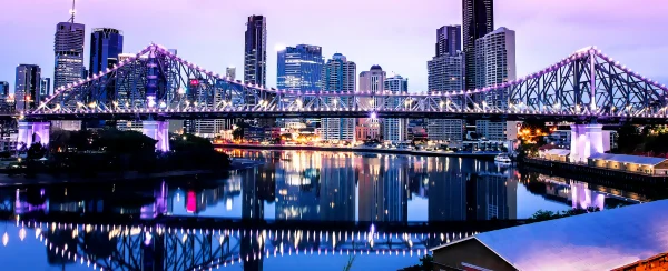 view of Brisbane skyline and bridge at dawn